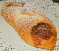 Picture of a baked caramelized apple turnover using croissant dough