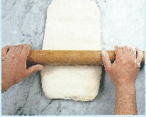 Picture of dough being rolled into rectangle